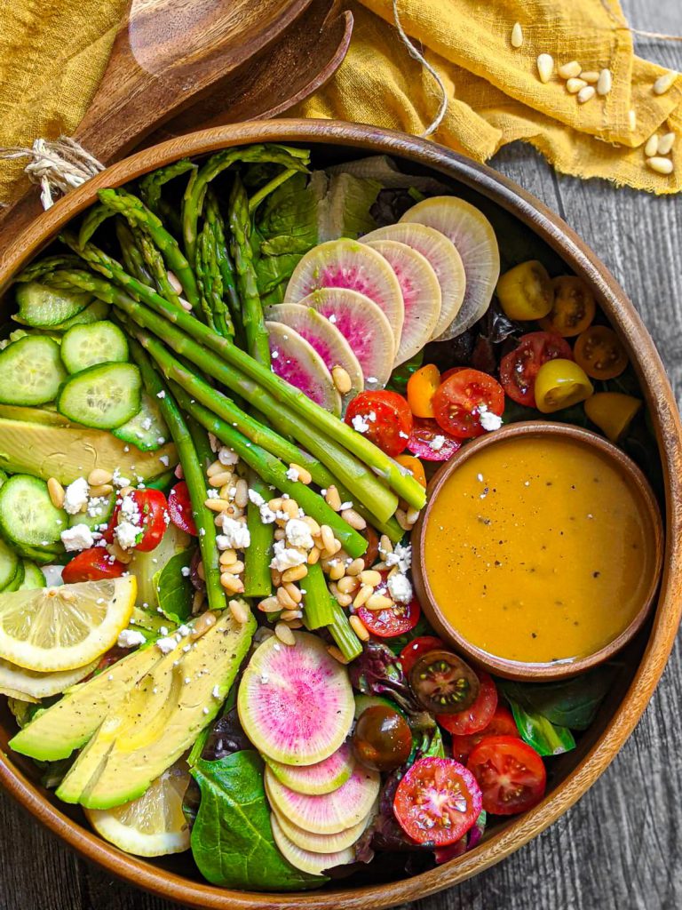 Salad in large acacia wood bowl